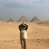 An Egypt Tour Reviewer taking a picture inside one of the Egyptian landmarks