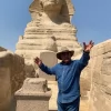 An Egypt Tour Reviewer taking a picture inside one of the Egyptian landmarks