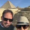 An Egypt Tour Reviewer taking a picture inside one of the Egyptian landmarks