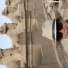 An Egypt Tour Reviewer taking a picture inside one of the Egyptian landmarks