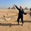 An Egypt Tour Reviewer taking a picture inside one of the Egyptian landmarks