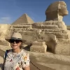An Egypt Tour Reviewer taking a picture inside one of the Egyptian landmarks