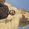 An Egypt Tour Reviewer taking a picture inside one of the Egyptian landmarks
