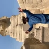 An Egypt Tour Reviewer taking a picture inside one of the Egyptian landmarks