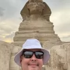 An Egypt Tour Reviewer taking a picture inside one of the Egyptian landmarks