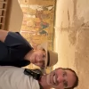 An Egypt Tour Reviewer taking a picture inside one of the Egyptian landmarks