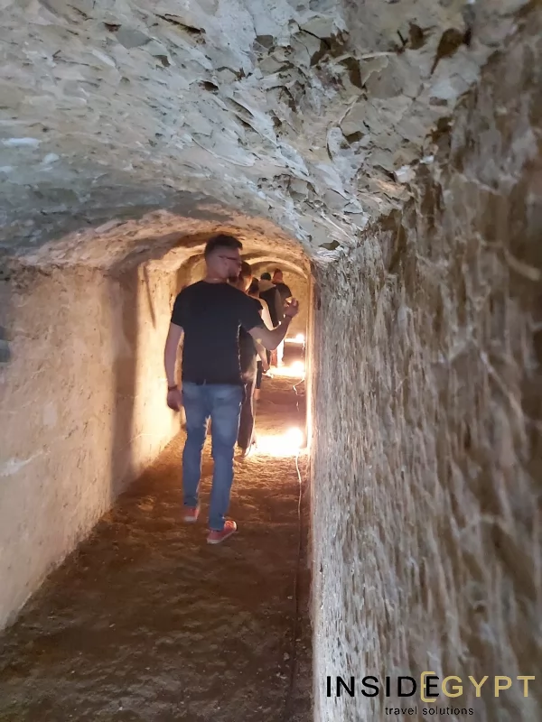Tourists exploring tunnels inside the Senuseret II pyramid 