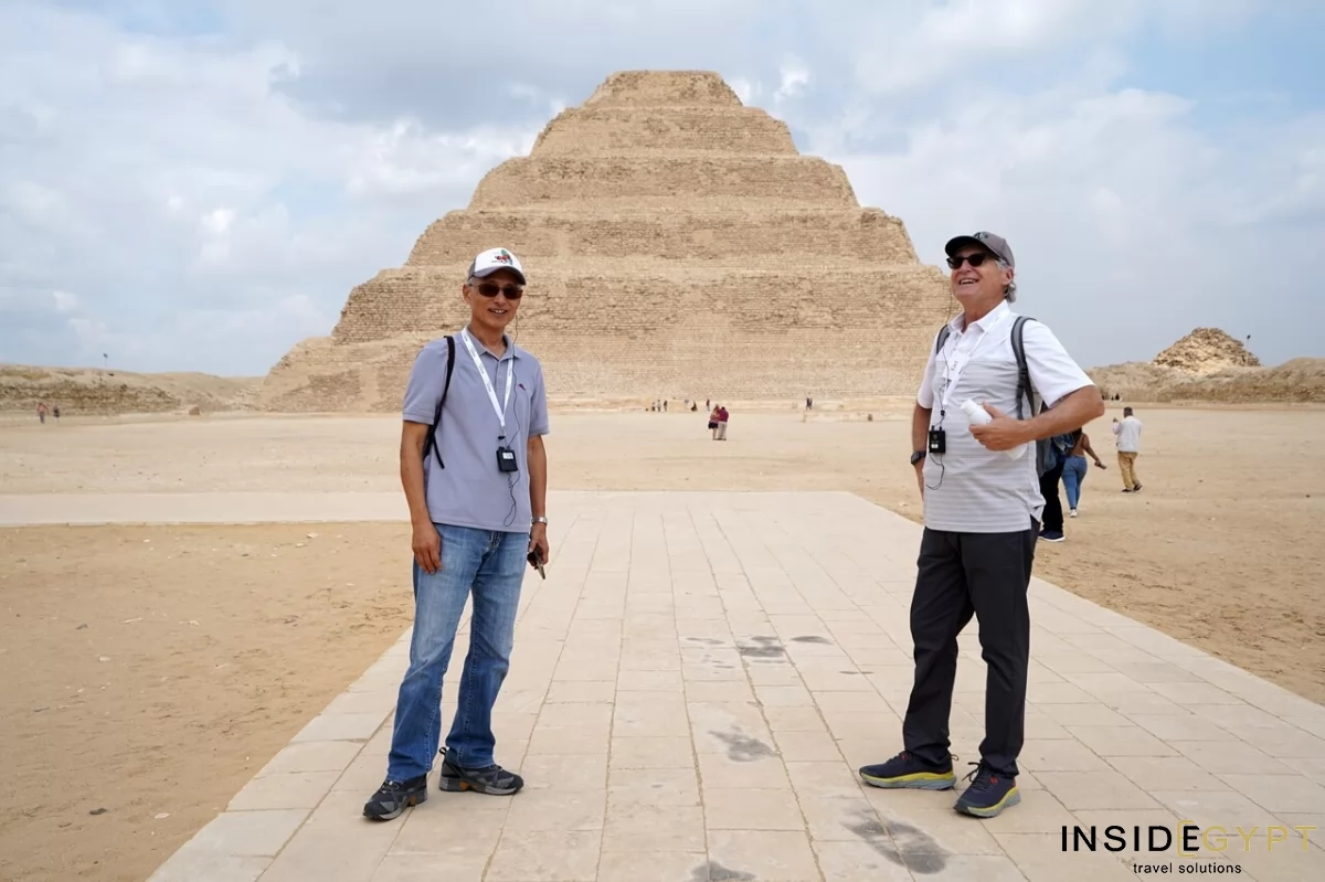 Two men in front Djoser Pyramid in Saqqara