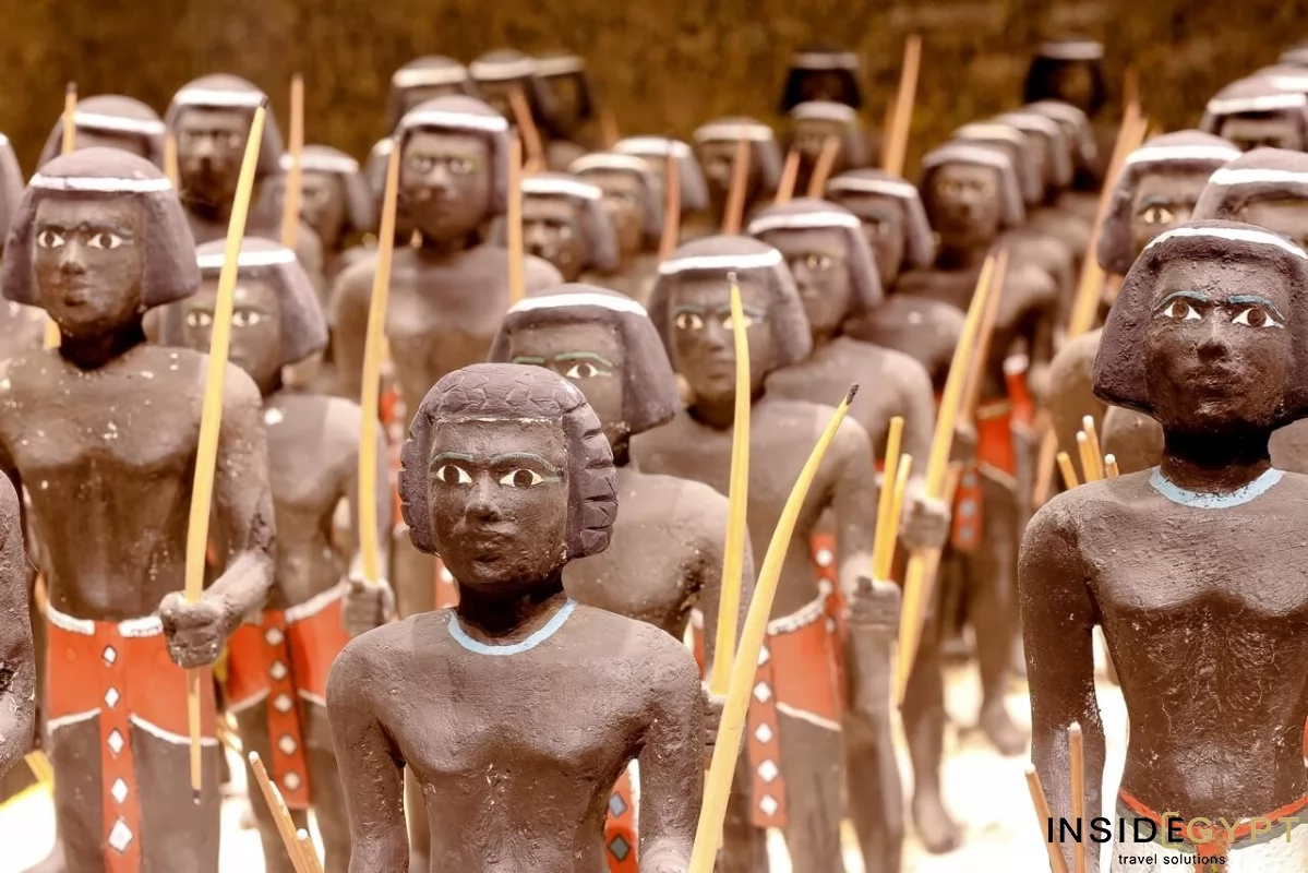 An ancient Egyptian depiction of Nubian warriors fighting in the pharaoh's army. Nubian Museum in Aswan 