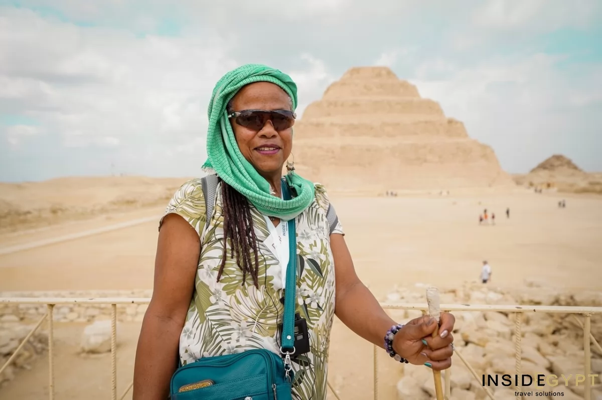 American tourist in front Djoser Pyramid in Saqqara
