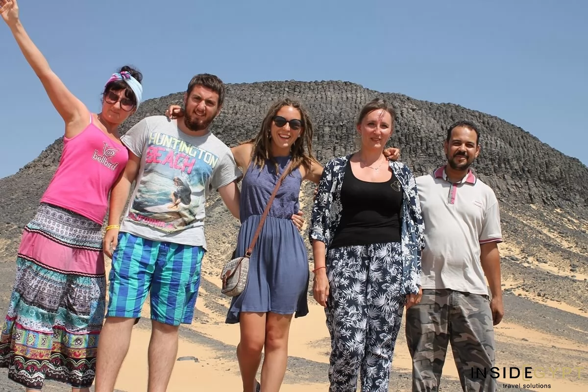 Group of tourists enjoying the white desert dunes in Egypt 