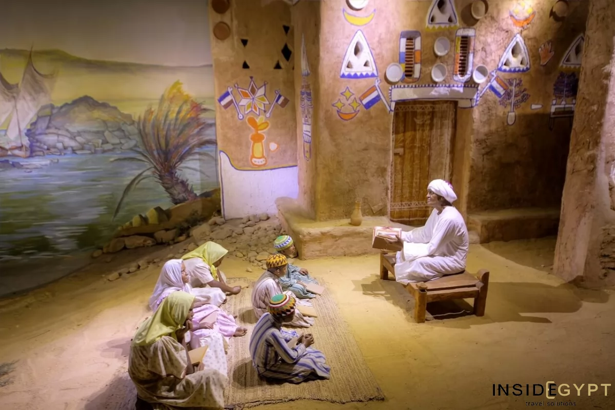 Learning the Koran in a Nubian village. Arranged genre scene at the Nubian Museum in Aswan.