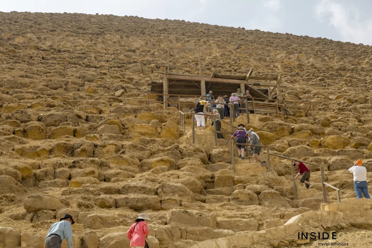 Tourists climbing the Red Pyramid in Dahshur 