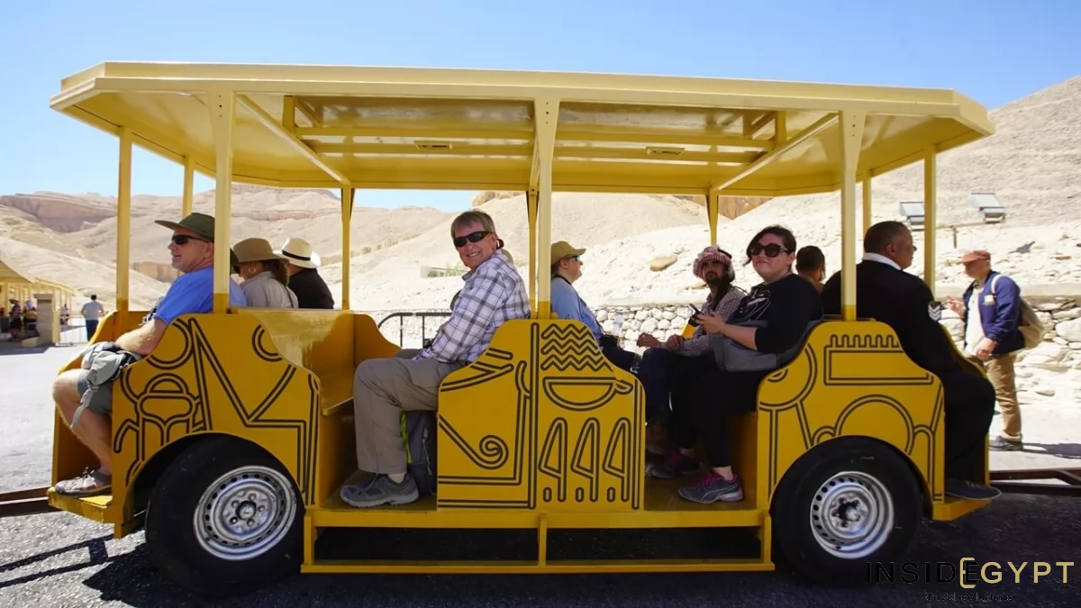Group of tourists in Egypt traveling in a Valley of the Kings train